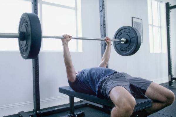 Bench pressing with westside hole spacing